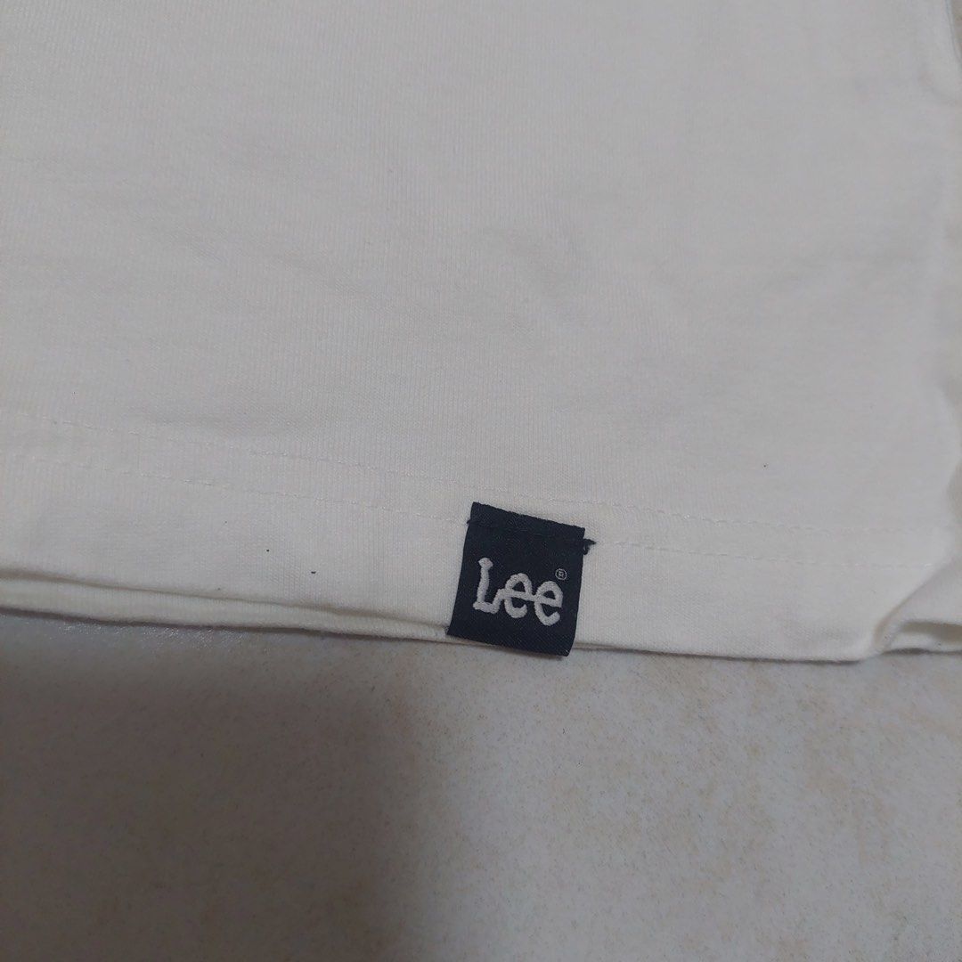 Lee T-shirt Size Small White Blue Graphic Tee (Category: Tshirts & Polo Shirts ) located in Quezon City. Submitted by _ysxh (Listing ID 1448301320, Image 2). Description: - White Lee t-shirt - Features blue and dark grey graphic design - 'SINCE 1889' and 'Lee' logo detail - Measurements: Width 45.5 cm, Length 65 cm - Perfect for casual everyday wear RFS: Decluttering - Shipping to be shouldered by buyer (Item is located in Quezon City) - Mode of 