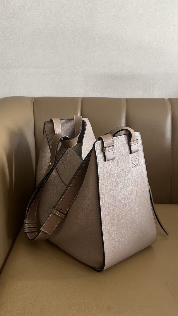 Loewe Hammock Bag in Grained Calfskin (Category: Luxury Bags & Wallets) located in Manila. Submitted by ther3se (Listing ID 1448359131, Image 1). Description: - Taupe Grained calfskin leather - Includes dust bag - Good condition - Has a minor edge chip and faint marker dot - Versatile and interior is spacious.