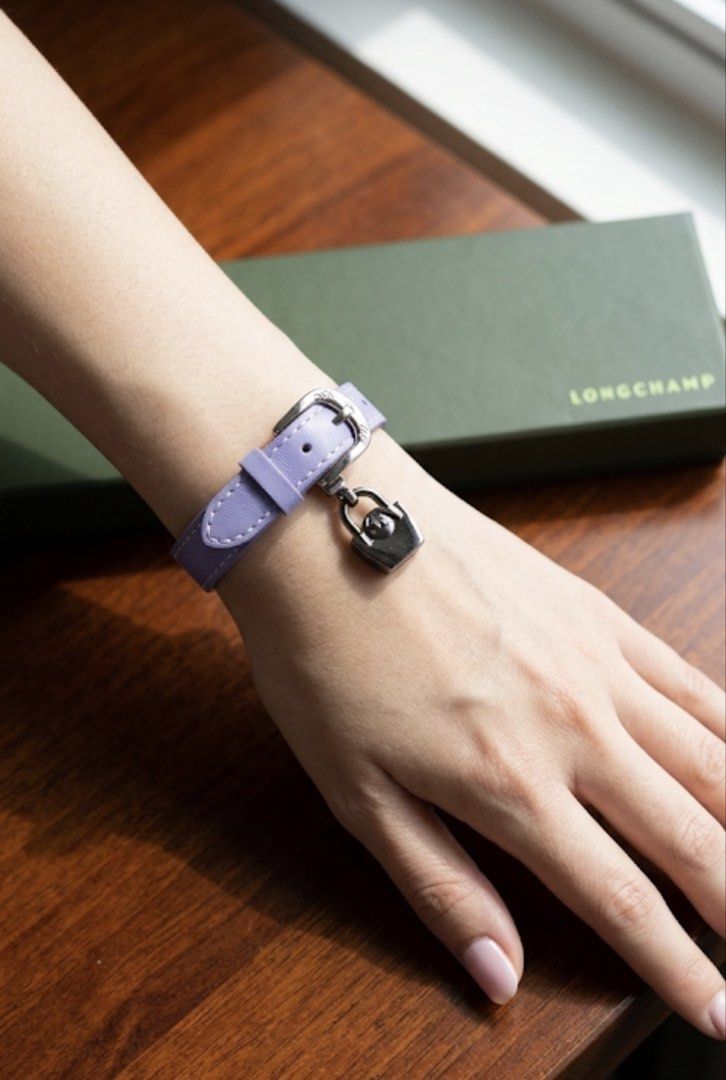 LONGCHAMP LE PLIAGE LEATHER BRACELET, PURPLE (Category: Luxury Accessories) located in Quezon City. Submitted by stuffiesetc (Listing ID 1437010748, Image 1). Description: LONGCHAMP LE PLIAGE LEATHER BRACELET, PURPLE guaranteed authentic. lightly used in very good condition.Has some minor scratches on the hardware. bought in italy for about Php11,000. Description: Original Longchamp Le Pliage Héritage bracelet made of genuine leather. The model h