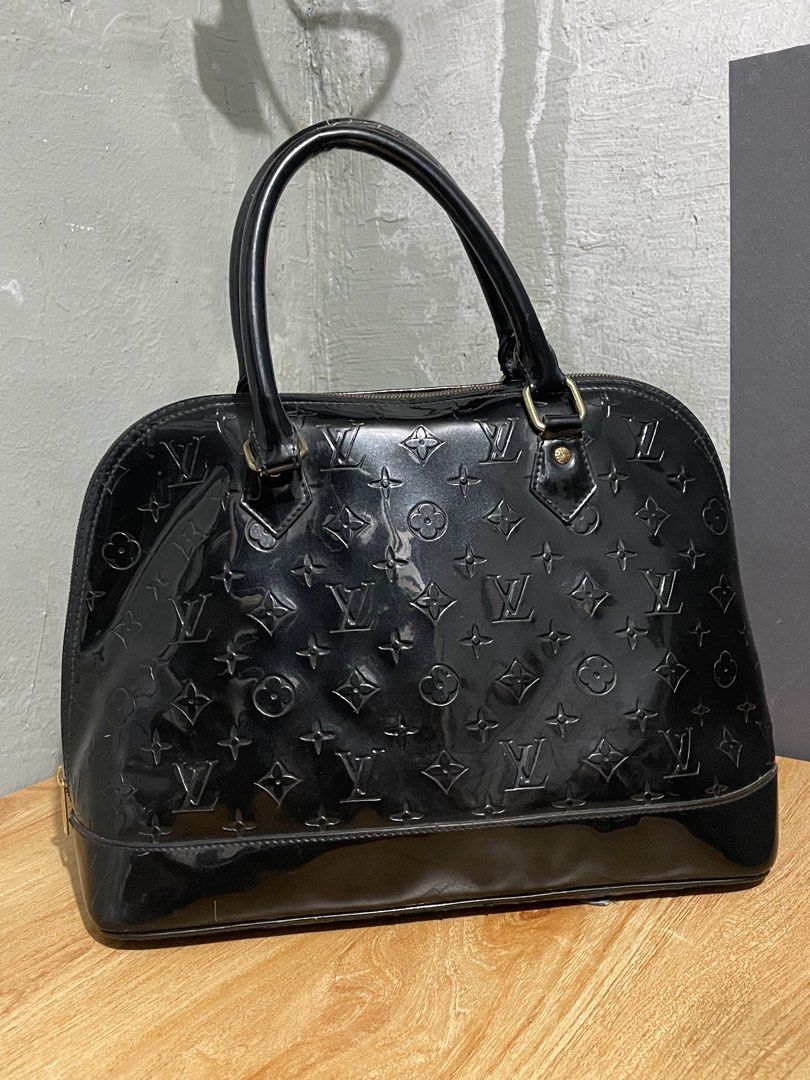 Louis Vuitton 2011 Monogram Vernis Alma GM Handbag (Category: Luxury Bags & Wallets) located in Manila. Submitted by claii_collection (Listing ID 1448371221, Image 2). Description: Louis Vuitton 2011 Monogram Vernis Alma GM Handbag - Large Size Bag (Can fit a Ipad Air) - Excellent Condition (Repaired) - Complete Side Engraved Tags and Inside Tags - Japan Surplus Finds .