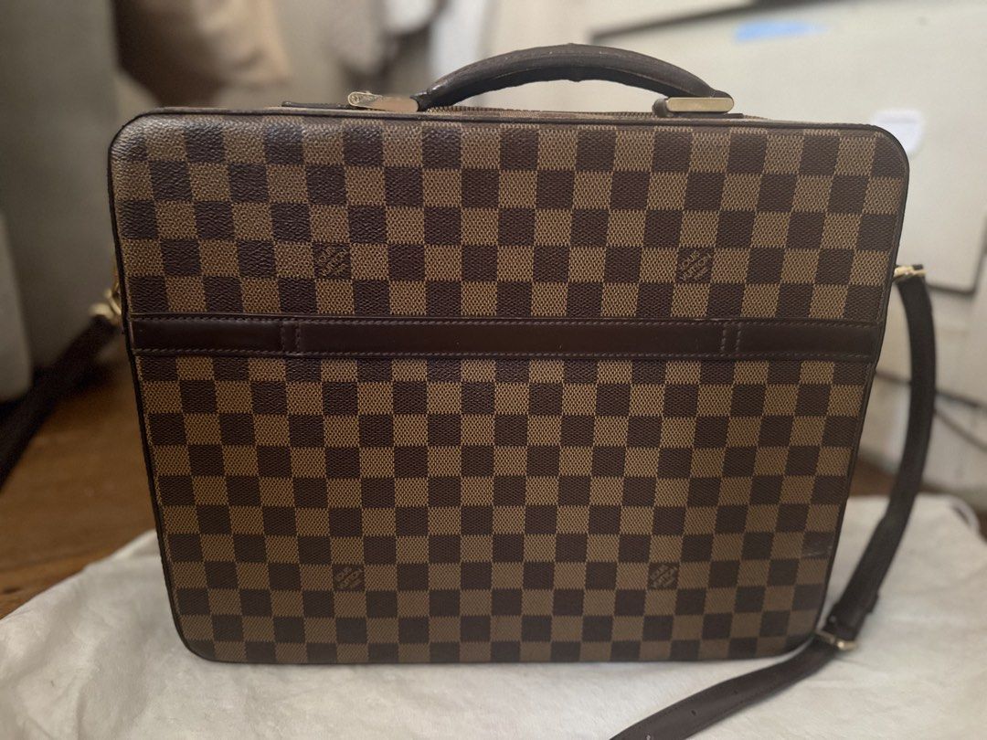 Louis Vuitton Damier Ebene Briefcase Bag (Category: Luxury Bags & Wallets) located in Manila. Submitted by happy.twinstars (Listing ID 1448353214, Image 2). Description: LOUIS VUITTON Authentic Vintage Damier Canvas Porte Ordinateur Sabana Computer Case Bag - Classic checkered pattern - Top handle and detachable shoulder strap - Embossed 'Louis Vuitton' logo on front - working zippers - Spacious interior, ideal for documents or a laptop - Perfect