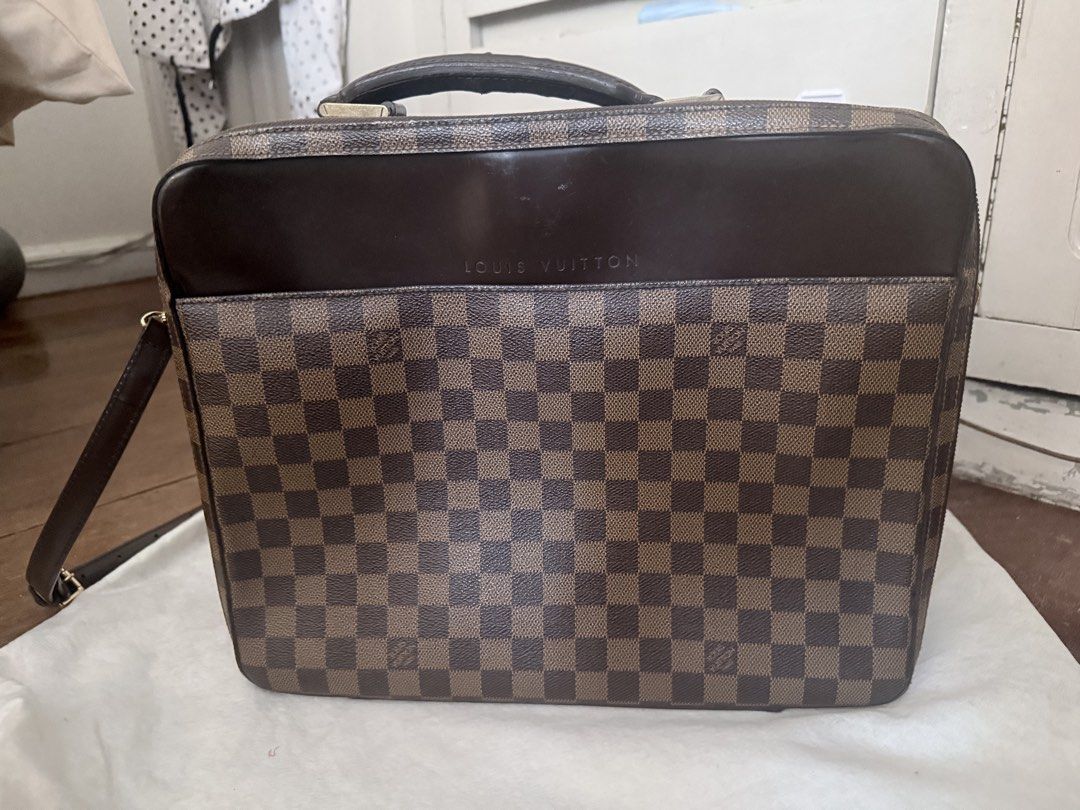 Louis Vuitton Damier Ebene Briefcase Bag (Category: Luxury Bags & Wallets) located in Manila. Submitted by happy.twinstars (Listing ID 1448353214, Image 1). Description: LOUIS VUITTON Authentic Vintage Damier Canvas Porte Ordinateur Sabana Computer Case Bag - Classic checkered pattern - Top handle and detachable shoulder strap - Embossed 'Louis Vuitton' logo on front - working zippers - Spacious interior, ideal for documents or a laptop - Perfect
