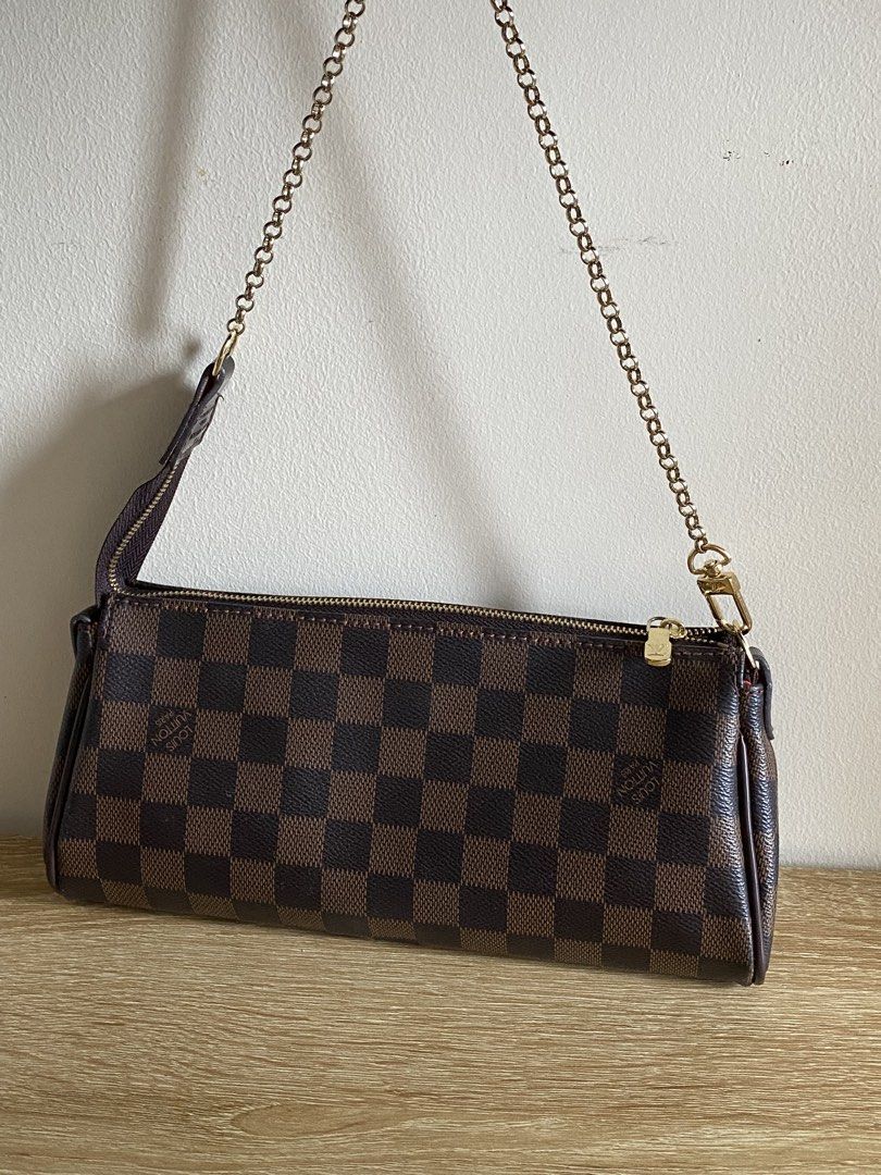 Louis Vuitton Damier Ebene Pochette Accessoires Bag (Category: Luxury Bags & Wallets) located in Manila. Submitted by matchatanuki (Listing ID 1448325457, Image 2). Description: - Louis Vuitton Damier Ebene canvas pochette - Features a chic gold chain strap - Secure zipper closure - Red fabric interior with minor marks - Ideal for carrying your essentials Needs cleaning inside With Sling.