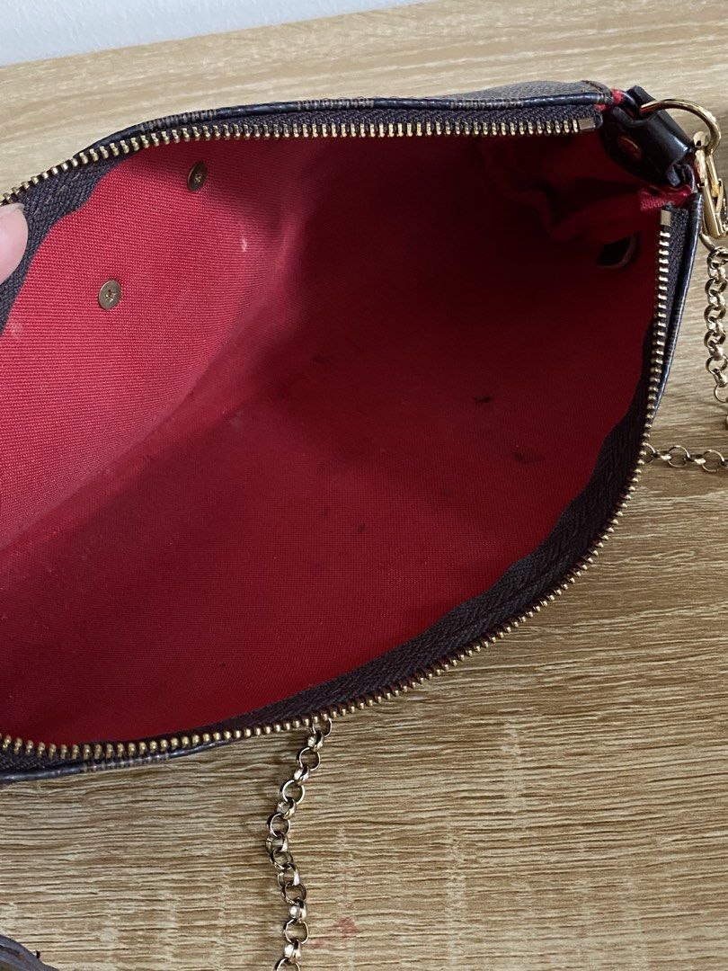 Louis Vuitton Damier Ebene Pochette Accessoires Bag (Category: Luxury Bags & Wallets) located in Manila. Submitted by matchatanuki (Listing ID 1448325457, Image 3). Description: - Louis Vuitton Damier Ebene canvas pochette - Features a chic gold chain strap - Secure zipper closure - Red fabric interior with minor marks - Ideal for carrying your essentials Needs cleaning inside With Sling.