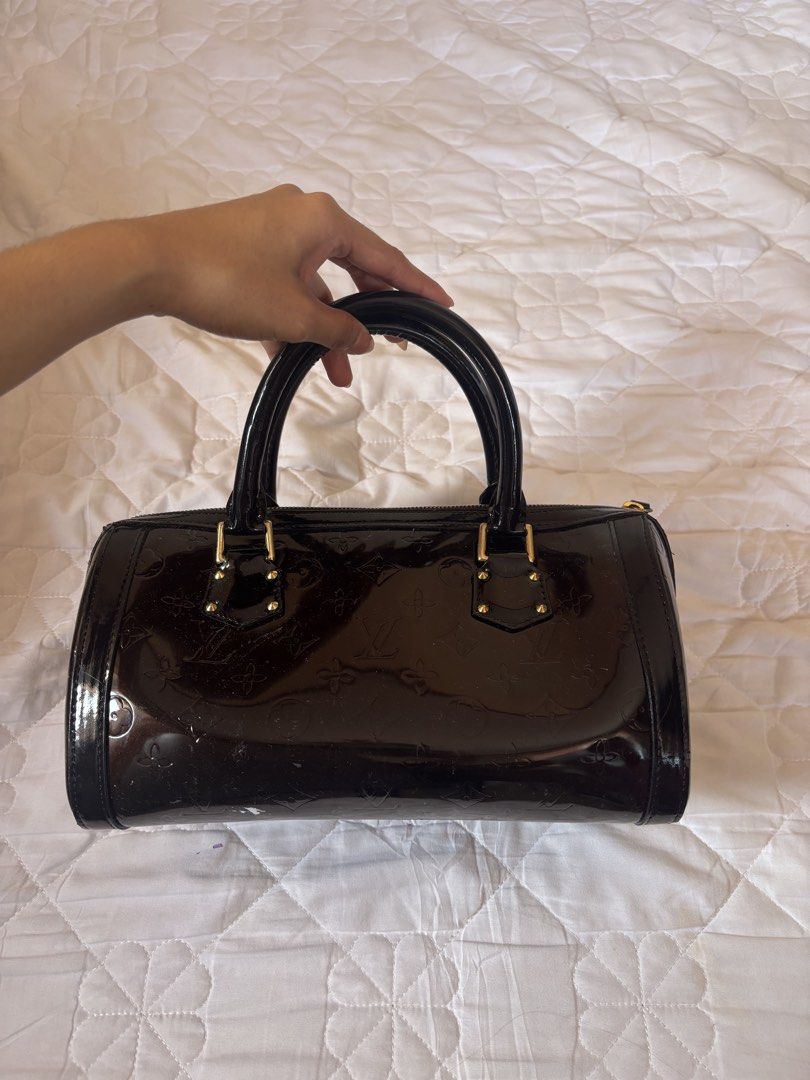 Louis Vuitton Monogram Vernis Alma BB (Category: Luxury Bags & Wallets) located in Subic. Submitted by joyclutter (Listing ID 1448324112, Image 2). Description: - Louis Vuitton Alma BB Bag - Material: Dark Brown Monogram Vernis Leather - Hardware: Gold-tone - Closure: Zipper - Handles: Top handles for carrying - Size: Small and compact - Perfect for: Everyday use or special occasions.