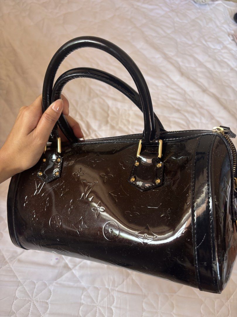 Louis Vuitton Monogram Vernis Alma BB (Category: Luxury Bags & Wallets) located in Subic. Submitted by joyclutter (Listing ID 1448324112, Image 3). Description: - Louis Vuitton Alma BB Bag - Material: Dark Brown Monogram Vernis Leather - Hardware: Gold-tone - Closure: Zipper - Handles: Top handles for carrying - Size: Small and compact - Perfect for: Everyday use or special occasions.