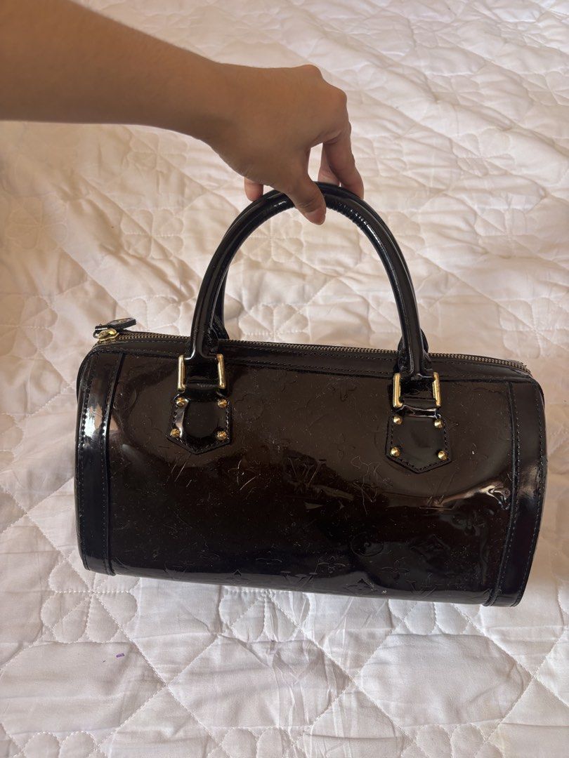 Louis Vuitton Monogram Vernis Alma BB (Category: Luxury Bags & Wallets) located in Subic. Submitted by joyclutter (Listing ID 1448324112, Image 1). Description: - Louis Vuitton Alma BB Bag - Material: Dark Brown Monogram Vernis Leather - Hardware: Gold-tone - Closure: Zipper - Handles: Top handles for carrying - Size: Small and compact - Perfect for: Everyday use or special occasions.
