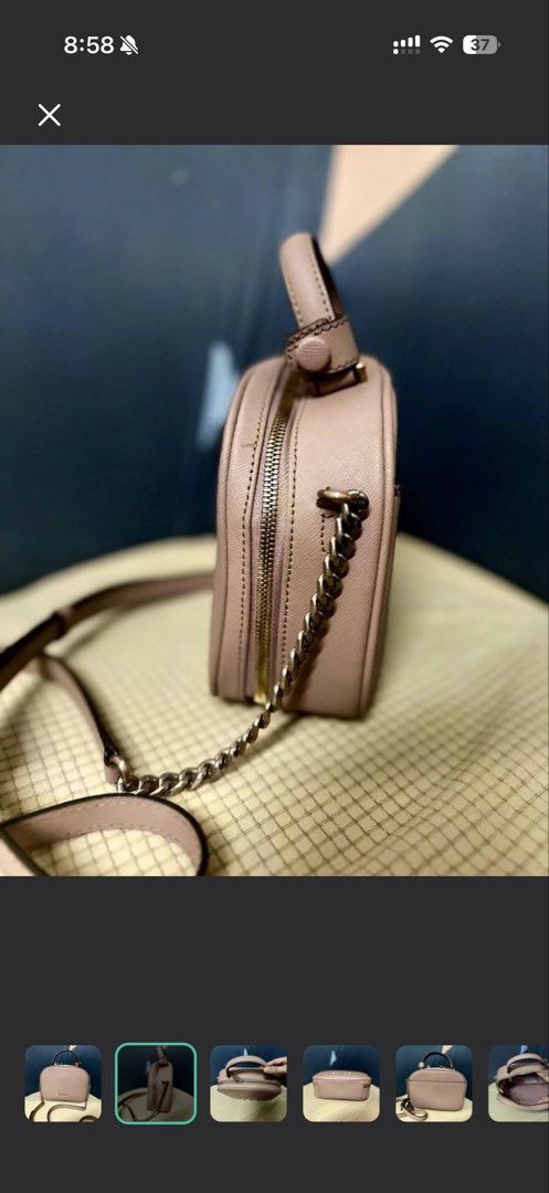 LOVCAT Pink Chain Strap Top Handle Bag (Category: Luxury Bags & Wallets) located in Manila. Submitted by cvmpreloved1212 (Listing ID 1448406927, Image 2). Description: - Cute pink LOVECAT handbag - Features a top handle - Includes a detachable chain strap - Secure zipper closure - Small and compact, ideal for carrying essentials - Versatile for casual outings or dressing up an outfit - Shows minimal signs of wear.