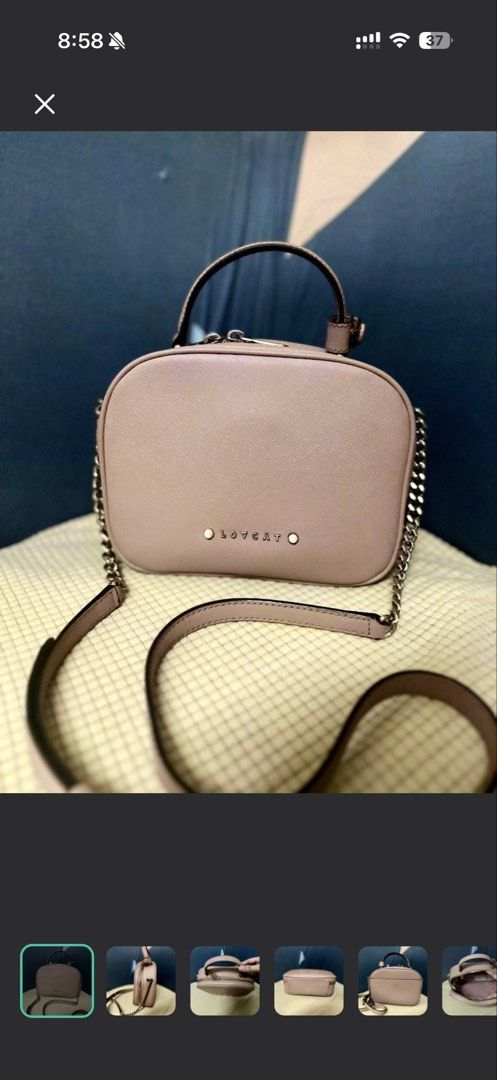 LOVCAT Pink Chain Strap Top Handle Bag (Category: Luxury Bags & Wallets) located in Manila. Submitted by cvmpreloved1212 (Listing ID 1448406927, Image 1). Description: - Cute pink LOVECAT handbag - Features a top handle - Includes a detachable chain strap - Secure zipper closure - Small and compact, ideal for carrying essentials - Versatile for casual outings or dressing up an outfit - Shows minimal signs of wear.