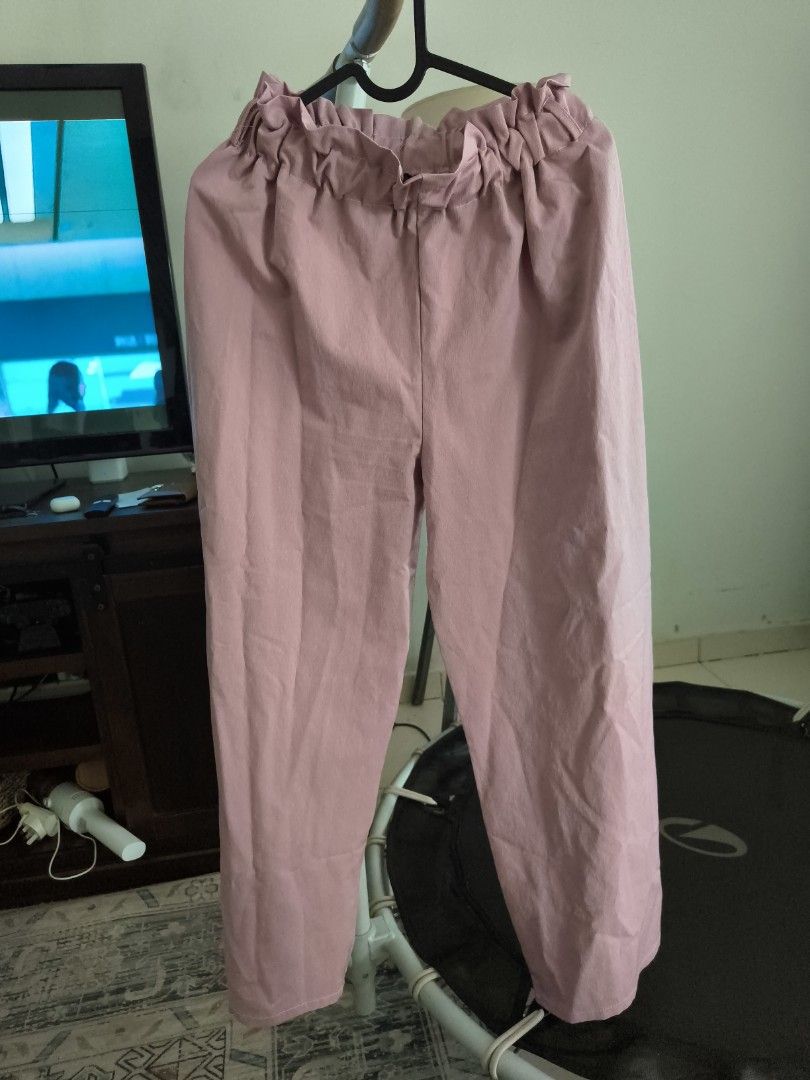 MC Vogue Pink Ruffled Waist Pants (Category: Other Bottoms) located in Johor Bahru. Submitted by msd_thrift (Listing ID 1448296879, Image 1). Description: - Brand: MC Vogue - Color: Pink - Style: High-waisted pants - Features: Ruffled elastic waistband, loose fit legs - Occasion: Casual outings - Condition: Please check photos for details - Size: S/M.