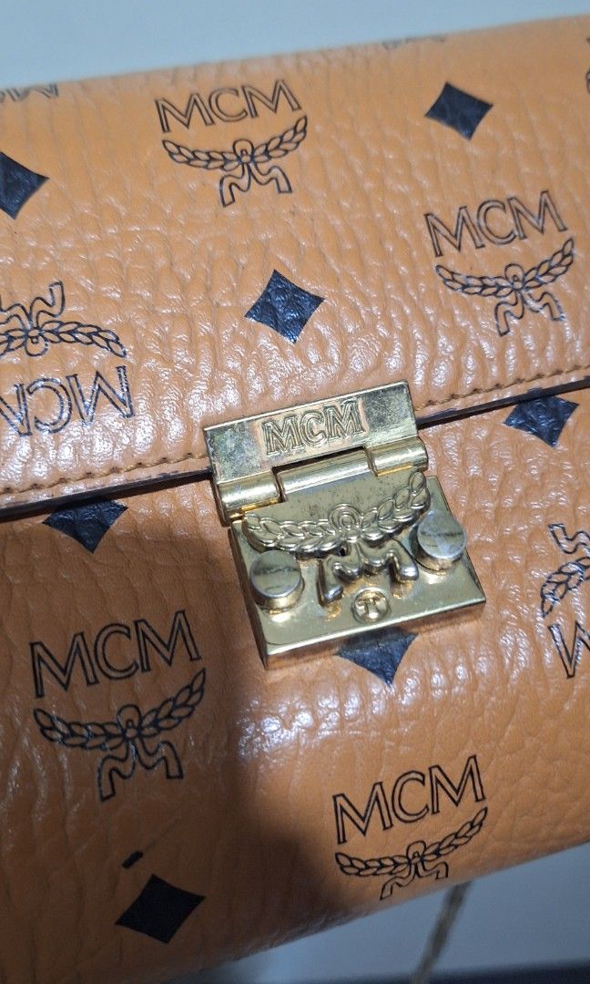 MCM sling bag (Category: Luxury Bags & Wallets) located in Quezon City. Submitted by little.tinderella (Listing ID 1448359028, Image 2). Description: MCM sling bag, good condition pa po ang leather, may signs of use sa kanyang hardwares. NGA, please self authenticate po..