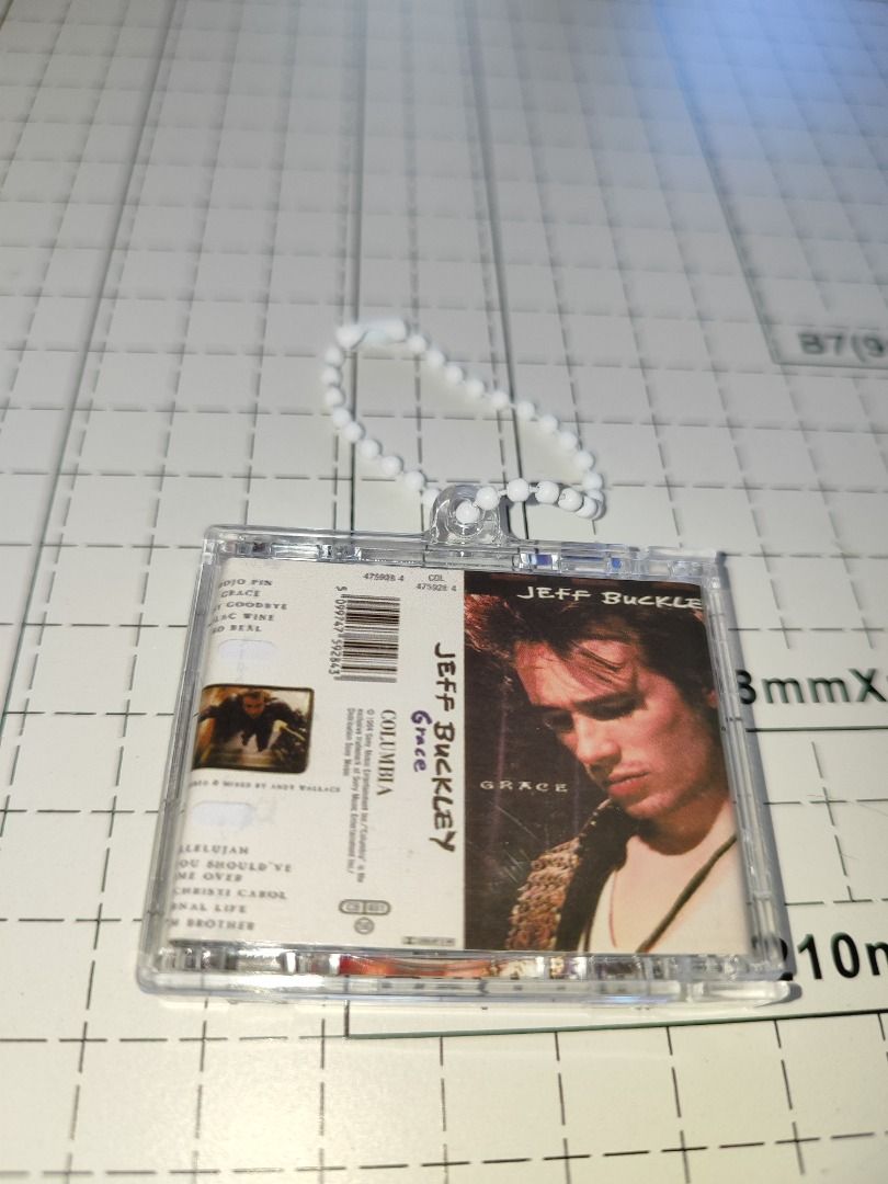 Mini Jeff Buckley: Grace NFC Keychains (Category: CDs & DVDs) located in Caloocan City. Submitted by nfcminicdkeychainsbytin (Listing ID 1448417729, Image 3). Description: - Miniature CD album keychain featuring Jeff Buckley's iconic 'Grace' album. - The CD itself is playable, a unique collectible! - Comes with a stylish beaded strap for easy carrying. - Ideal gift for Jeff Buckley fans or music memorabilia enthusiasts. - Small, portable, and a g
