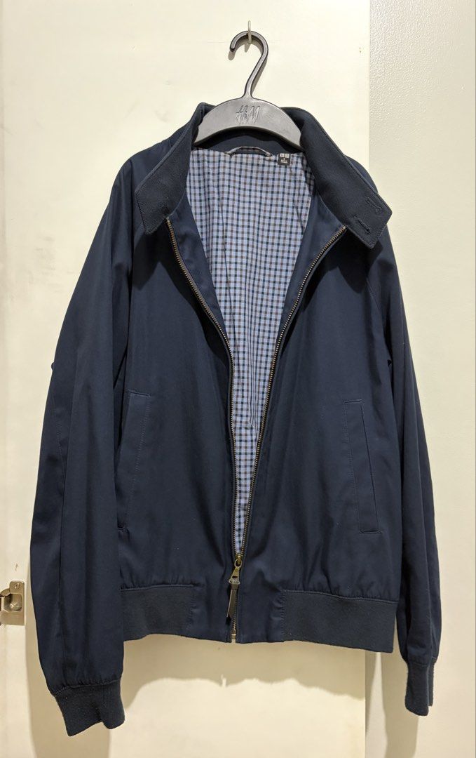Uniqlo Navy Blue Jacket with Gingham Lining (Category: Coats, Jackets and Outerwear) located in Las Pinas. Submitted by tindefensor (Listing ID 1448426389, Image 1). Description: - Classic navy blue jacket - Cool blue and brown gingham lining - Zip-up front with a button collar - Ribbed cuffs and hem for a snug fit - Ideal for layering and adding a sharp, stylish touch to any outfit - With signs of usage.