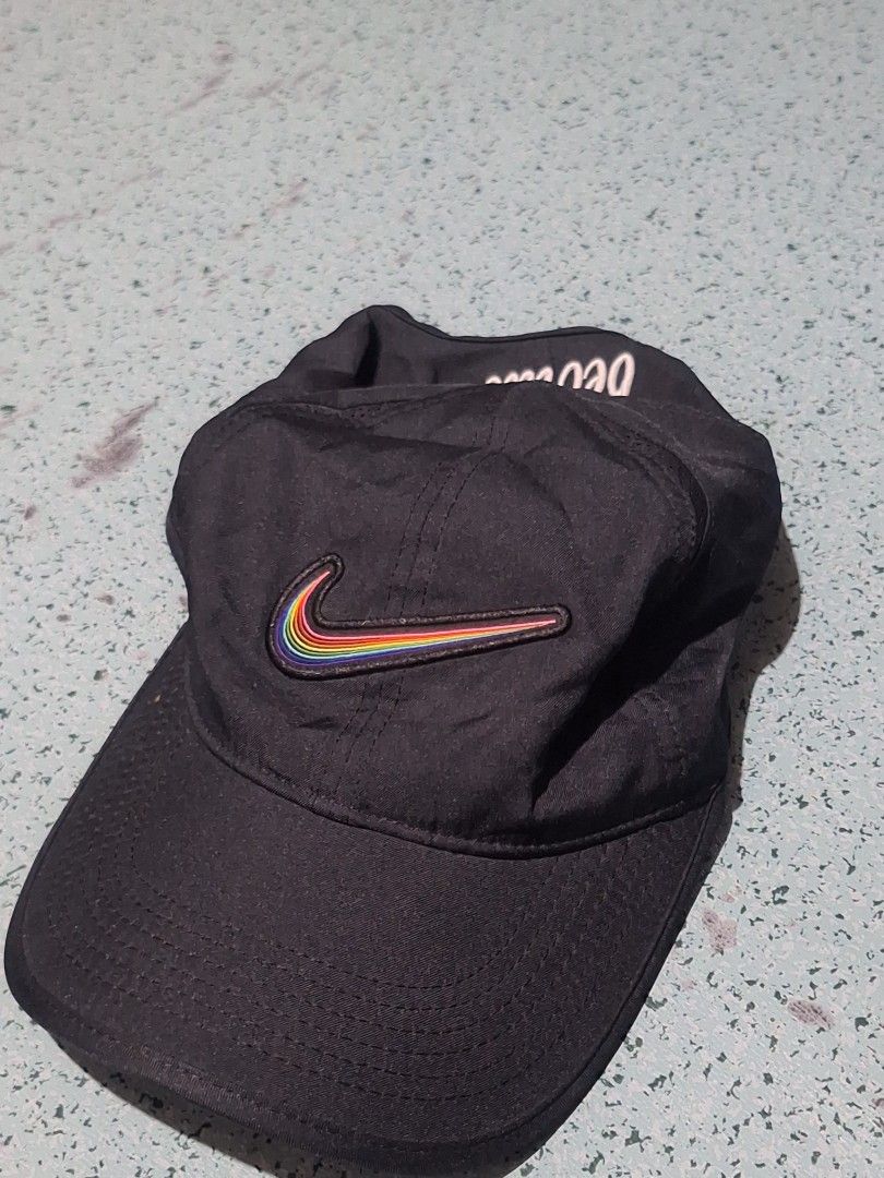 Nike Be True Featherlight Dri-Fit Cap Rainbow Swoosh (Category: Caps & Hats) located in Paranaque City. Submitted by boiwiz01 (Listing ID 1448391736, Image 1). Description: - Black Nike Dri-Fit Featherlight Cap - Features iconic rainbow swoosh logo - 'betrue' embroidery on the side - Inner band with a vibrant geometric pattern - Lightweight and breathable, ideal for running or everyday wear.
