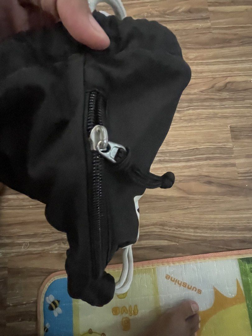 Nike Drawstring Bag Black White Swoosh (Category: Backpacks) located in Cavite. Submitted by yvetteroyce (Listing ID 1448337576, Image 3). Description: - Classic black Nike drawstring bag - Iconic white swoosh logo on front - Side zippered pocket for extra storage - Drawstrings double as shoulder straps - Ideal for gym, sports, or everyday use - Easy to carry and access items.