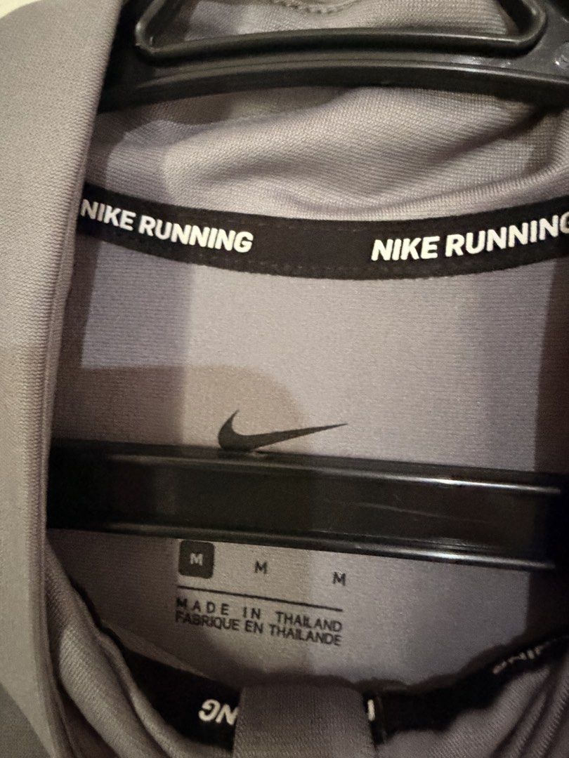 Nike Running Quarter Zip Long Sleeve Men's M (Category: Activewear) located in Manila. Submitted by bookman23 (Listing ID 1448313397, Image 3). Description: - Grey Nike Running Long Sleeve Top - Quarter zip design - Size: Medium - Material: 100% Polyester - Made in Thailand - Ideal for running and workouts - Comfortable and breathable fabric.