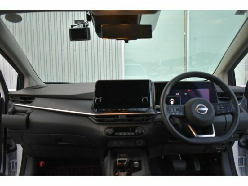 Nissan Note e-POWER Hybrid Premium (A) (Category: Used Cars) located in Singapore. Submitted by limgreenhouse236 (Listing ID 1448415962, Image 3). Description: White Nissan Note e-POWER. Hybrid model. Modern interior with large touchscreen and digital display. Spacious boot for storage. Sleek exterior design. Ready for a new owner..