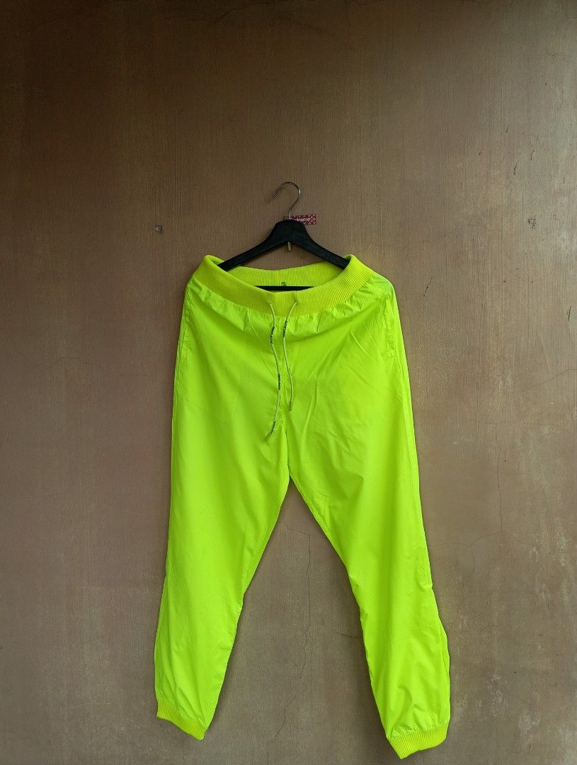 Off White Neon Track Pants (Category: Activewear) located in Lipa City. Submitted by MEECHYTWO2TWO (Listing ID 1448298752, Image 2). Description: • OFF WHITE NEON TRACK PANTS - Size: 38 / Best fit Large - Waistline 30-36 - Length: 40 - Location: Lipa City, Batangas - Excellent condition - Color rate: 10/10 - Additional sf +75 - Mop: GCASH/NO COD - Payment first tomorrow will be shipped.