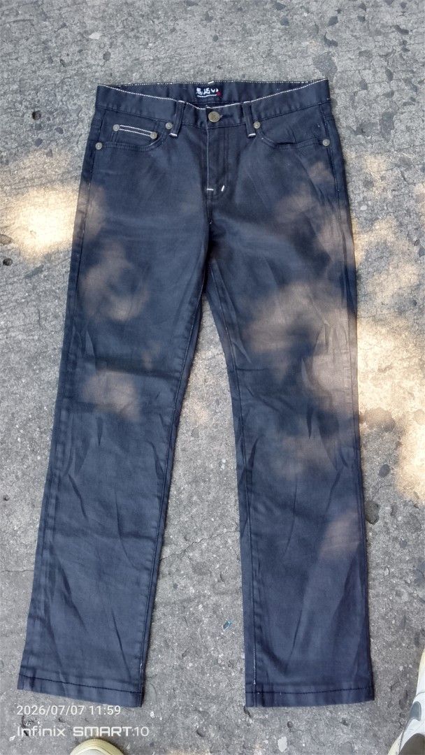 ONARAI Dragon Embroidered Jeans Size 31 (Category: Jeans) located in Manila. Submitted by joseph_thrift (Listing ID 1448419429, Image 2). Description: - Dark wash jeans with unique dragon embroidery on back pockets. - Features a button fly closure. - Made with coated fabric for a distinct look. - Size: W- 31 L- 42 - Please check photos for detailed condition..