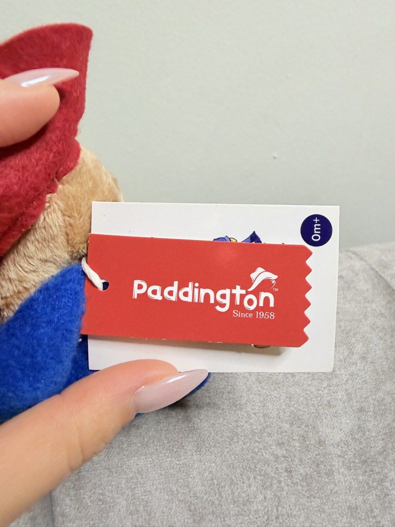 Original Paddington Bear Plush Toy with Red Hat and Blue Coat (Category: Toys & Games) located in Kuala Lumpur. Submitted by di12345 (Listing ID 1448356404, Image 3). Description: - Adorable Paddington Bear plush toy - Features iconic blue duffle coat and red hat - Brand new with tag attached (Rainbow Designs) - Approximately 6 inches tall - Ideal for Paddington enthusiasts or as a thoughtful gift.