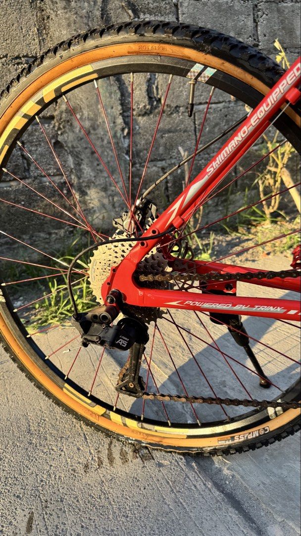 Phantom by trinx Bike (Category: Bicycles) located in Tarlac. Submitted by ethncip (Listing ID 1448355932, Image 2). Description: specs: - phantom frame - compass skinwall tires - saturn atlas v2 hub 6pawls - shimano cogs - shimano altus fd - shimano mt200 hydraulic brakes - 9 speed ltwoo A5 rd and shifter - fork and seat are stock - ragusa crank freebie rnox helmet naka bike skin, maingay ang hubs and takaw pansin sa daan note: decals lang yung 