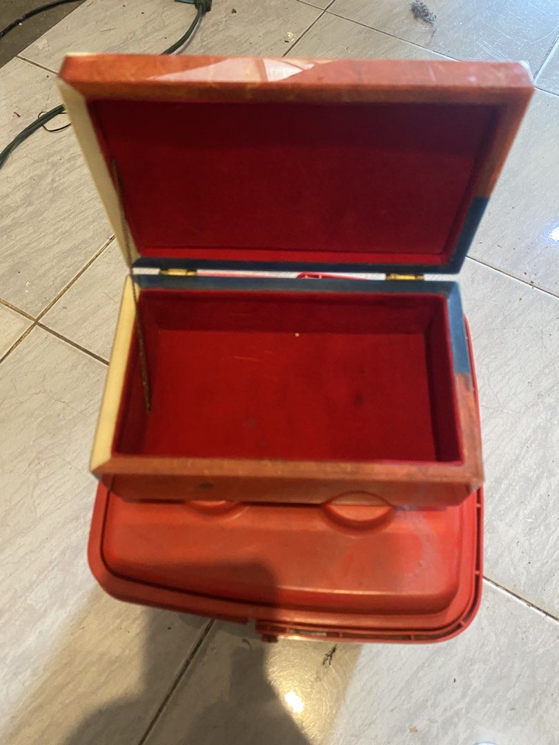 Philippine Centenary 100 Years Kalayaan Storage Box (Category: Storage Boxes & Baskets) located in Marikina City. Submitted by jtv17 (Listing ID 1448344004, Image 2). Description: - Commemorative storage box for Philippine Centenary (1898-1998). - Features Philippine flag design and '100 Kalayaan 1898-1998' inscription. - Interior lined with red fabric. - Ideal for organizing small personal items. - Shows some signs of wear, but fully functional.