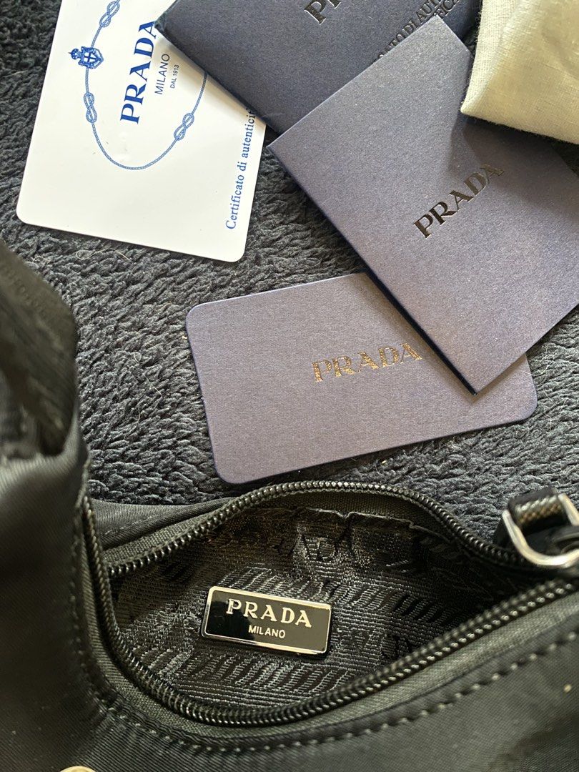 Prada Nylon Shoulder Bag (Category: Luxury Bags & Wallets) located in Las Pinas. Submitted by harper_preloved (Listing ID 1448395497, Image 2). Description: - Japan Flea market finds - Authentic Prada shoulder bag - Black nylon material - Comes with authenticity cards and dust bag - YKK zipper.