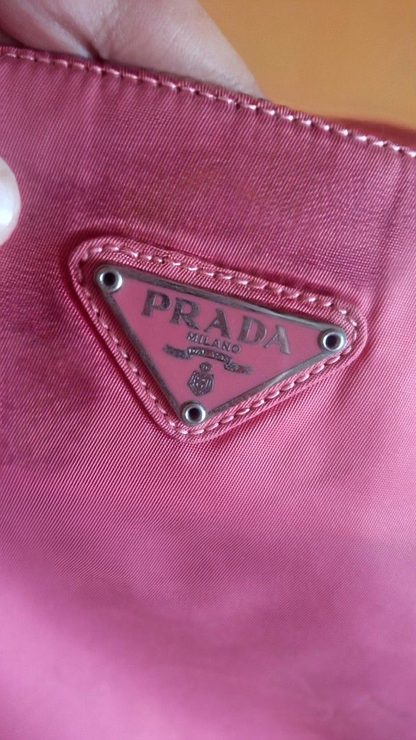 Prada Pink Nylon Tessuto Shoulder Bag (Category: Luxury Bags & Wallets) located in Camiling. Submitted by nobleforest_84f01e (Listing ID 1448379515, Image 2). Description: ✨ AUTHENTIC VINTAGE PRADA NYLON BAG ✨ • Price: ₱4,000 • Shipping: Plus shipping fee (Shouldered by buyer via J&T or LBC) DETAILS & ISSUES (Please read carefully / Selling as-is): • Source: Bought from Japan 🇯🇵 • Color: Pink. (Note: Colors may slightly vary due to camera light