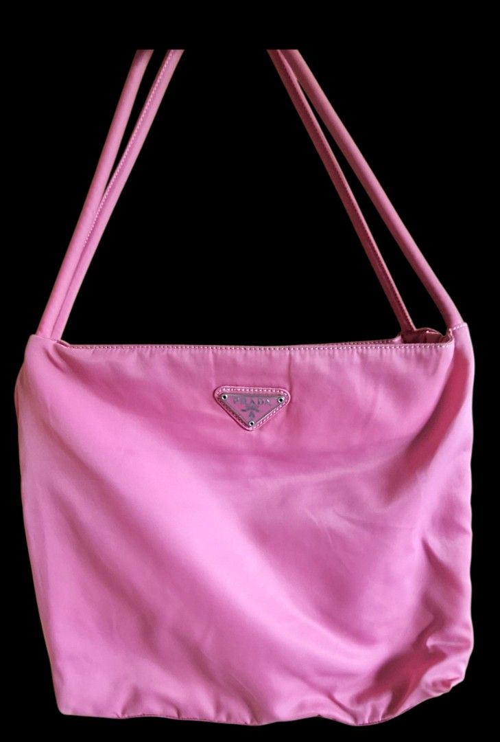 Prada Pink Nylon Tessuto Shoulder Bag (Category: Luxury Bags & Wallets) located in Camiling. Submitted by nobleforest_84f01e (Listing ID 1448379515, Image 1). Description: ✨ AUTHENTIC VINTAGE PRADA NYLON BAG ✨ • Price: ₱4,000 • Shipping: Plus shipping fee (Shouldered by buyer via J&T or LBC) DETAILS & ISSUES (Please read carefully / Selling as-is): • Source: Bought from Japan 🇯🇵 • Color: Pink. (Note: Colors may slightly vary due to camera light