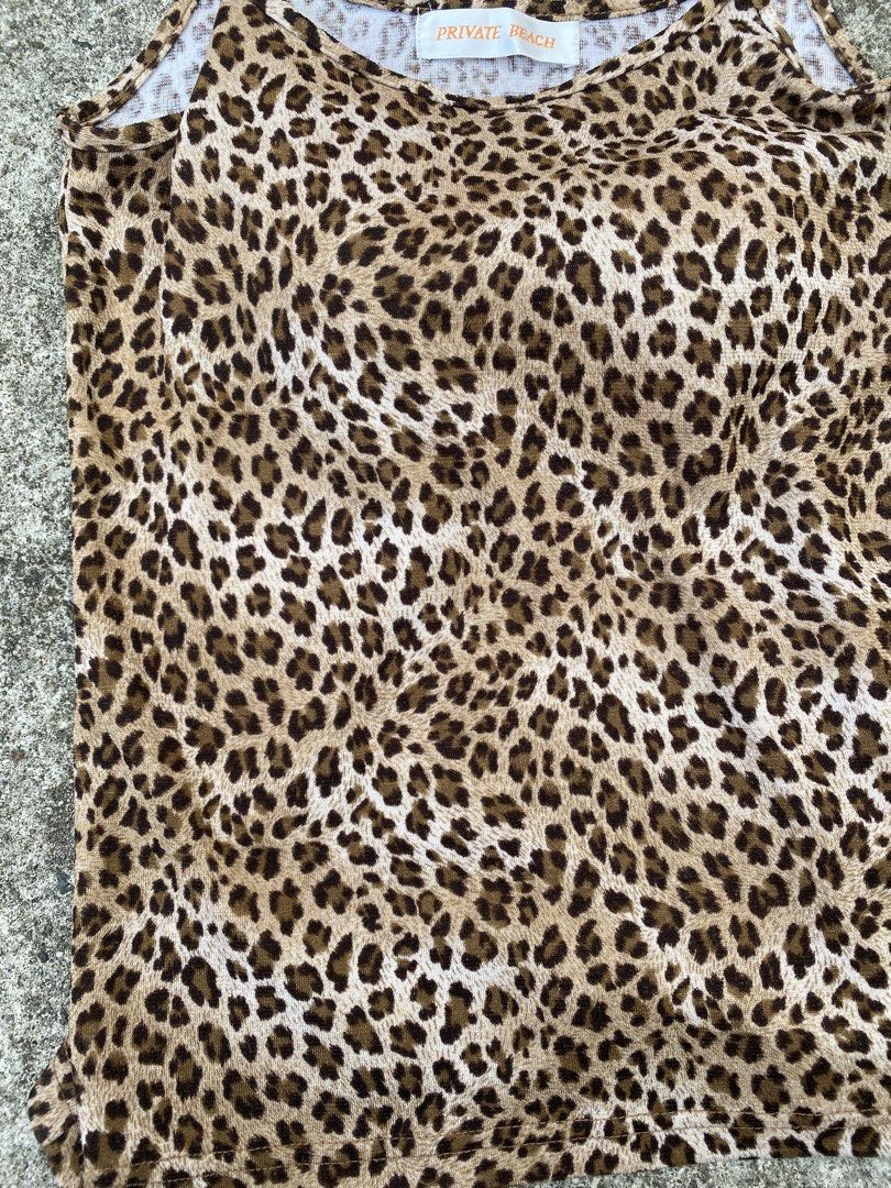 Private Beach Leopard Print Tank Top (Category: Sleeveless) located in Cavite. Submitted by grabanddeclutter (Listing ID 1448396375, Image 3). Description: - Cute leopard print camisole - Brand: Private Beach - Features spaghetti straps - Made from soft and stretchy material - Versatile: great for layering or wearing on its own - Pairs well with jeans or shorts - In excellent and great condition - Dimensions: Width 13.5 Length 17 No COD gcash pay