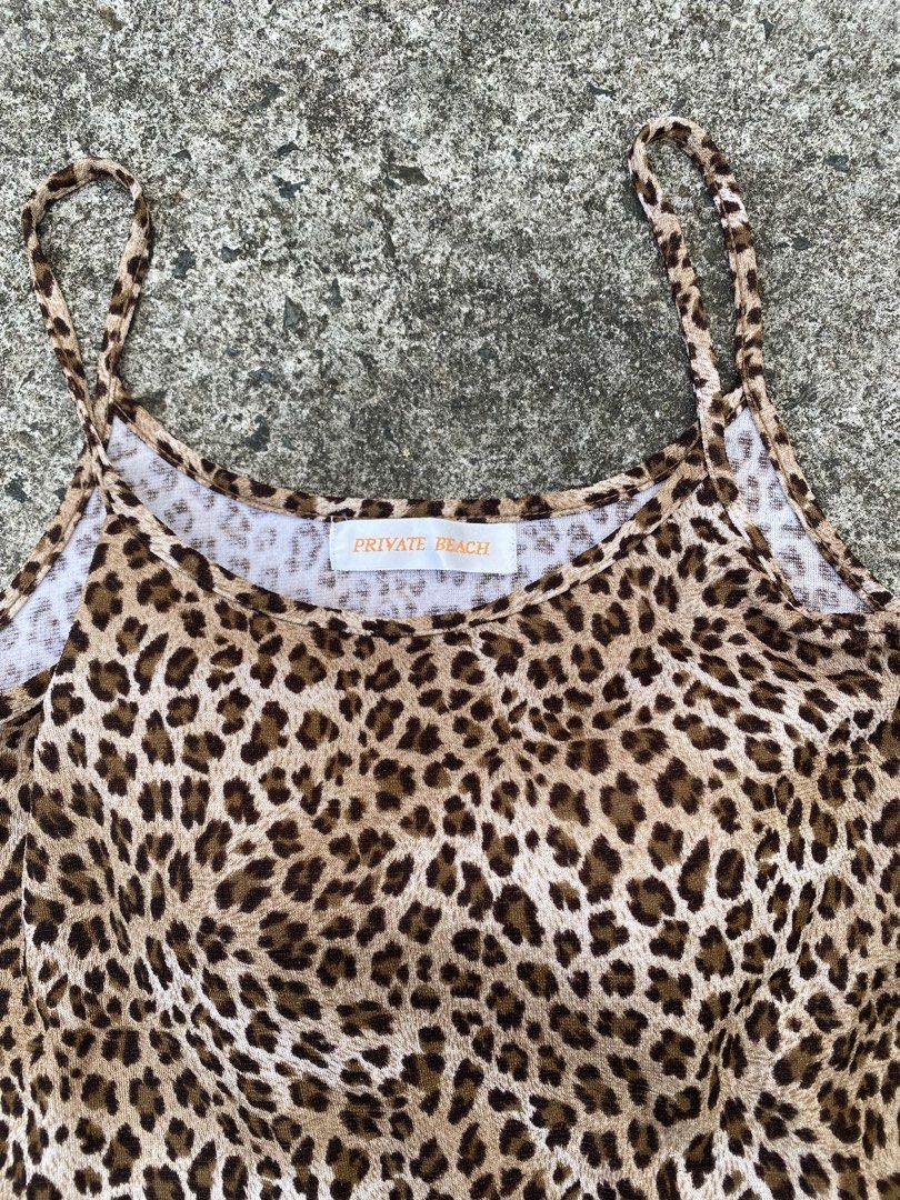 Private Beach Leopard Print Tank Top (Category: Sleeveless) located in Cavite. Submitted by grabanddeclutter (Listing ID 1448396375, Image 2). Description: - Cute leopard print camisole - Brand: Private Beach - Features spaghetti straps - Made from soft and stretchy material - Versatile: great for layering or wearing on its own - Pairs well with jeans or shorts - In excellent and great condition - Dimensions: Width 13.5 Length 17 No COD gcash pay
