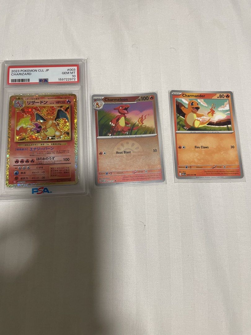 2023 Charizard Evolution (Category: Graded Cards) located in Singapore. Submitted by fantasticwatch (Listing ID 1448384713, Image 1). Description: - Lot of 3 Pokemon cards - Includes PSA 10 graded Charizard - Also includes holo Charmeleon and Charmander cards - Ideal for Pokemon collectors - Rare set, don't miss out!.
