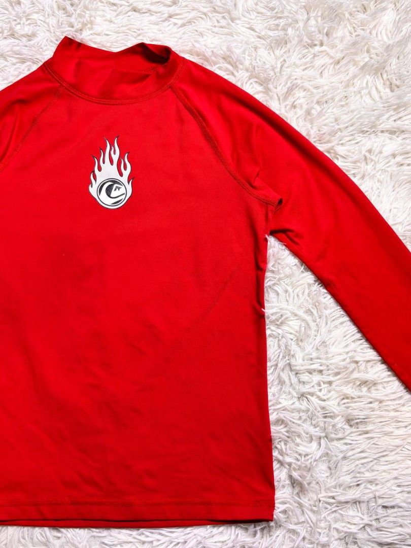 Quiksilver Red Long Sleeve Rash Guard UV Tech (Category: Babies & Kids Fashion) located in Catbalogan. Submitted by kristinapi (Listing ID 1448326084, Image 2). Description: - Red Quiksilver long sleeve rash guard - Features Quiksilver flame logo on chest - Made with UV Tech material for sun protection - Ideal for surfing, beach days, and water sports - Long sleeves provide excellent sun coverage.