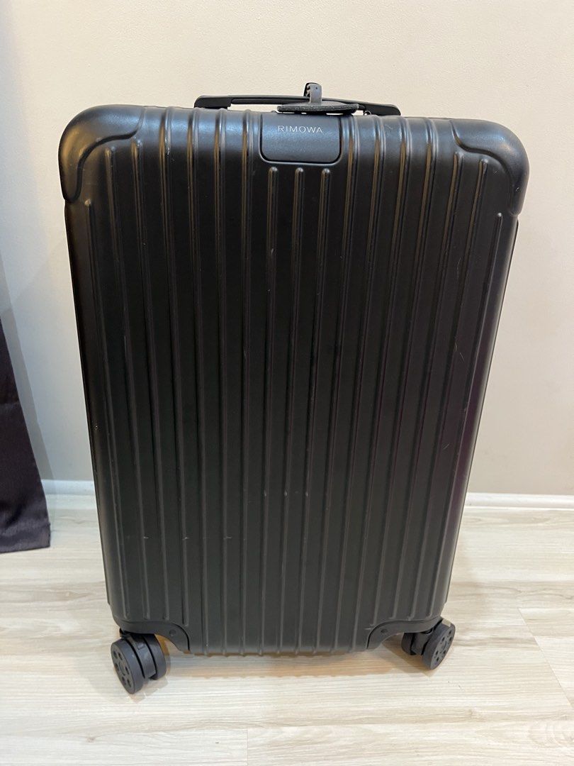 RIMOWA Essential Check-In M (Matte Black) (Category: Luggage) located in Mandaue City. Submitted by msportern00951 (Listing ID 1448418358, Image 2). Description: - Classic black Rimowa suitcase - Iconic ribbed design - Smooth four-wheel rolling - Sturdy, reliable handle - Ideal for all your travel needs.