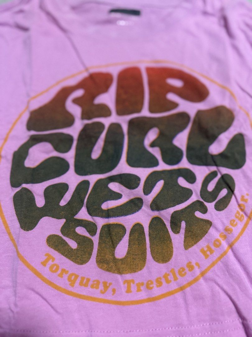Rip Curl Wetsuits Pink Cropped T-shirt Size Small (Category: Shirts) located in Imus. Submitted by danessalyn (Listing ID 1448424279, Image 2). Description: - Brand: Rip Curl - Style: Pink cropped t-shirt - Size: Estimated Small - Design: 'Wetsuits' graphic with surf spot names (e.g., Torquay, Trestles) - Occasion: Great for casual wear.