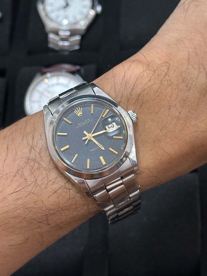 Rolex Oyster Perpetual Precision Watch (Category: Luxury Watches) located in Cabanatuan. Submitted by albertgonzales27 (Listing ID 1448321202, Image 3). Description: - Vintage Rolex Oyster Perpetual Precision - Dark grey dial with gold markers and hands - Stainless steel case and bracelet - Automatic movement - Classic timepiece for watch enthusiasts.