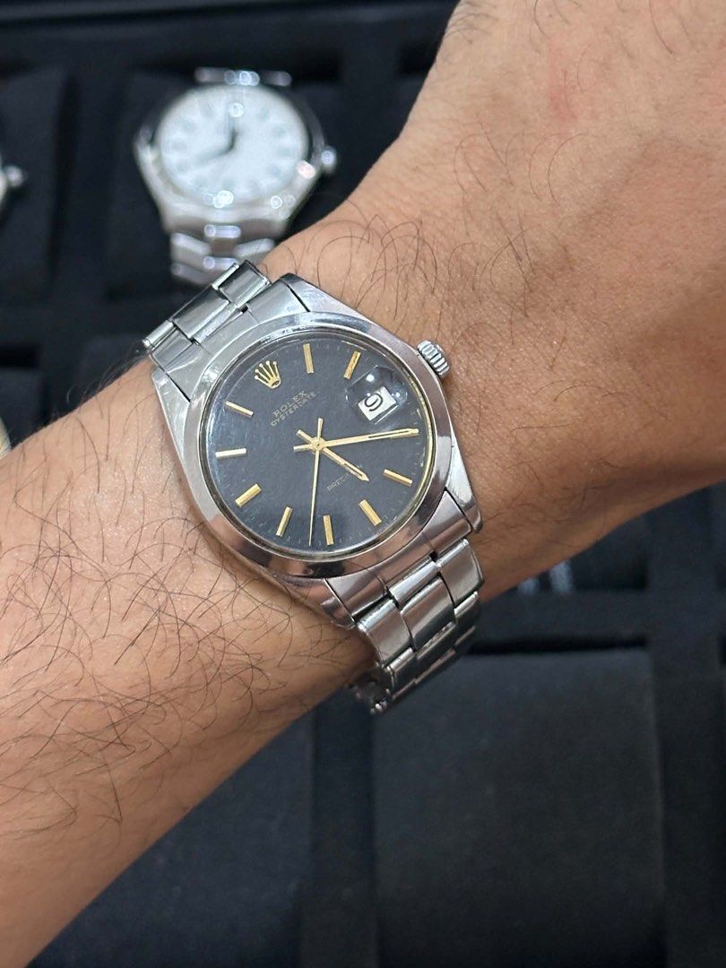 Rolex Oyster Perpetual Precision Watch (Category: Luxury Watches) located in Cabanatuan. Submitted by albertgonzales27 (Listing ID 1448321202, Image 2). Description: - Vintage Rolex Oyster Perpetual Precision - Dark grey dial with gold markers and hands - Stainless steel case and bracelet - Automatic movement - Classic timepiece for watch enthusiasts.