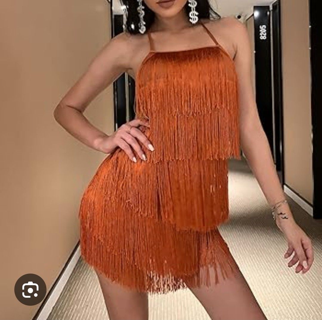 Rust orange fringe tassle dress (Category: Evening dresses & gowns) located in Batangas. Submitted by micaelaul (Listing ID 1448285609, Image 2). Description: Xl on tag keri large up to xxl pa because the inner lining is stretchable, I don't know if it's romper or dress basta may inner short at mukhang dress kapag soot 😅 #70's #retro #flapperdress #tassledress #Gatsbystyle.