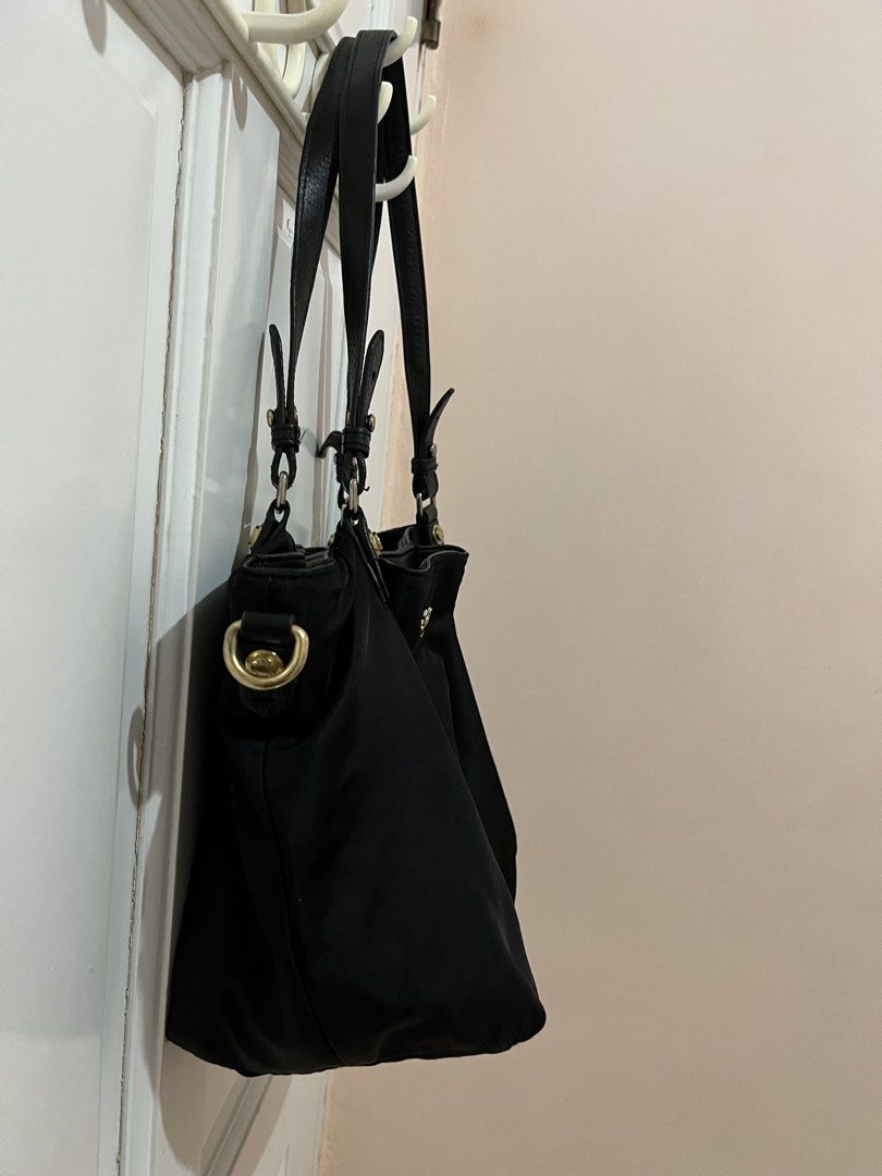 🔥Sale! Salad Black Nylon Tote Shoulder Bag (Category: Shoulder Bags) located in San Pablo. Submitted by restoredchic (Listing ID 1448430033, Image 3). Description: Salad Black Nylon Tote Shoulder Bag Authentic Salad Brand Black Nylon Tote Shoulder Bag. With gold toone hardware and genuine leather handle Nylon Tessuto like ( buttery texture) lightweight, splash-proof nylon body paired with sturdy leather shoulder straps. Casual slouchy hobo/tote 