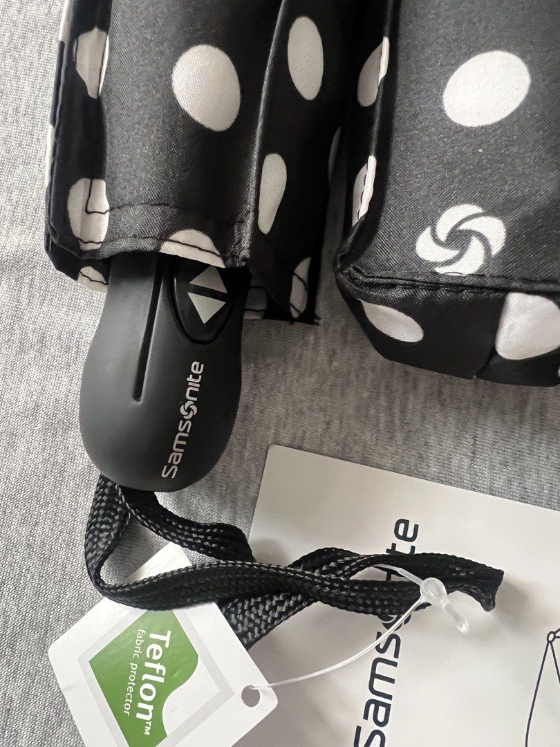 Samsonite Compact Auto Open/Close Polka Dot Umbrella (Category: Umbrellas) located in Muntinlupa City. Submitted by 09leah77 (Listing ID 1448283896, Image 2). Description: - Black umbrella with cute white polka dots - Compact and easy to carry - Auto open and close feature for convenience - Made with Teflon fabric for excellent water repellency - Includes a handy wrist strap - Ideal for keeping in your bag for sudden rain showers - 850.00 each - 