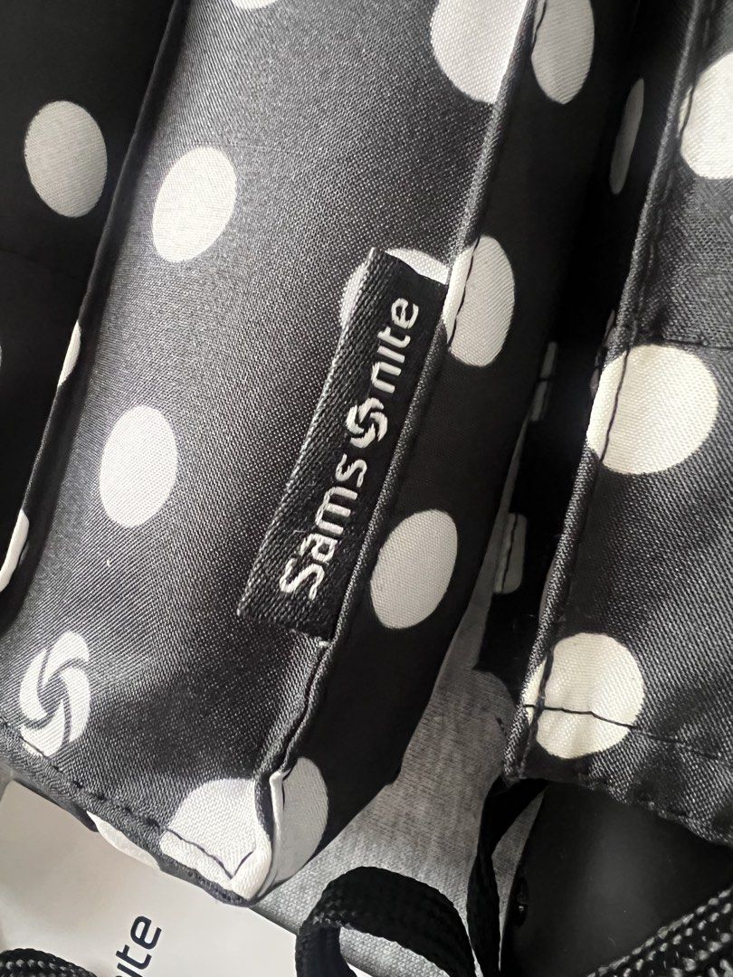 Samsonite Compact Auto Open/Close Polka Dot Umbrella (Category: Umbrellas) located in Muntinlupa City. Submitted by 09leah77 (Listing ID 1448283896, Image 3). Description: - Black umbrella with cute white polka dots - Compact and easy to carry - Auto open and close feature for convenience - Made with Teflon fabric for excellent water repellency - Includes a handy wrist strap - Ideal for keeping in your bag for sudden rain showers - 850.00 each - 
