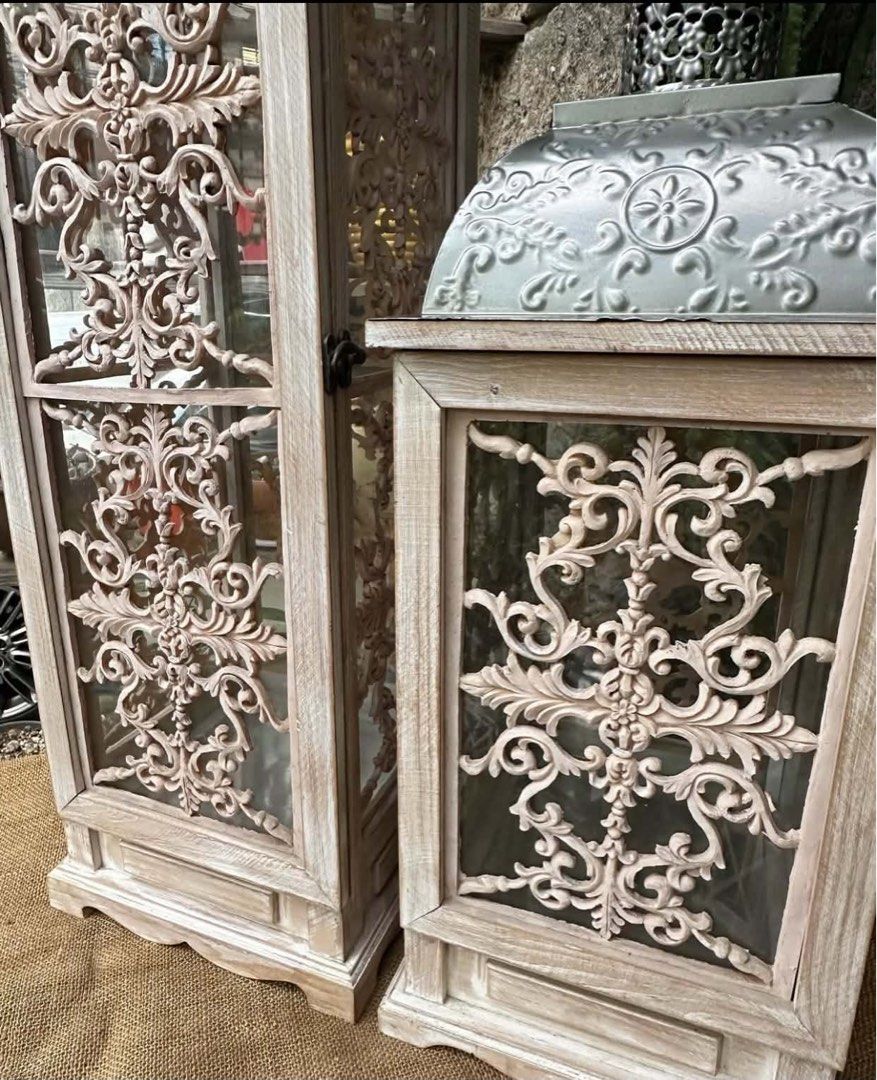 Set of 2 Vintage Style Decorative Lanterns (Category: Lighting) located in Cainta. Submitted by alvinroberto (Listing ID 1448366372, Image 3). Description: Sold as Set- 8000 -Metal, Wood and Glass Lantern w/ Polyresin Decor, -Very heavy, - Small-9.75”x9.75”x25” - Big-9.75”x9.75”x35.75”, MOD: lalamove.