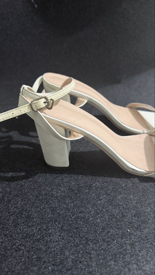 SIZE 8 (US) White Block Heel Sandals with Ankle Strap (Category: Heels) located in Manila. Submitted by rhinrin (Listing ID 1448415578, Image 2). Description: - Stylish white block heel sandals - Modern square toe design - Adjustable ankle strap with buckle closure - Comfortable heel height for extended wear - Versatile for casual or dressy outfits.