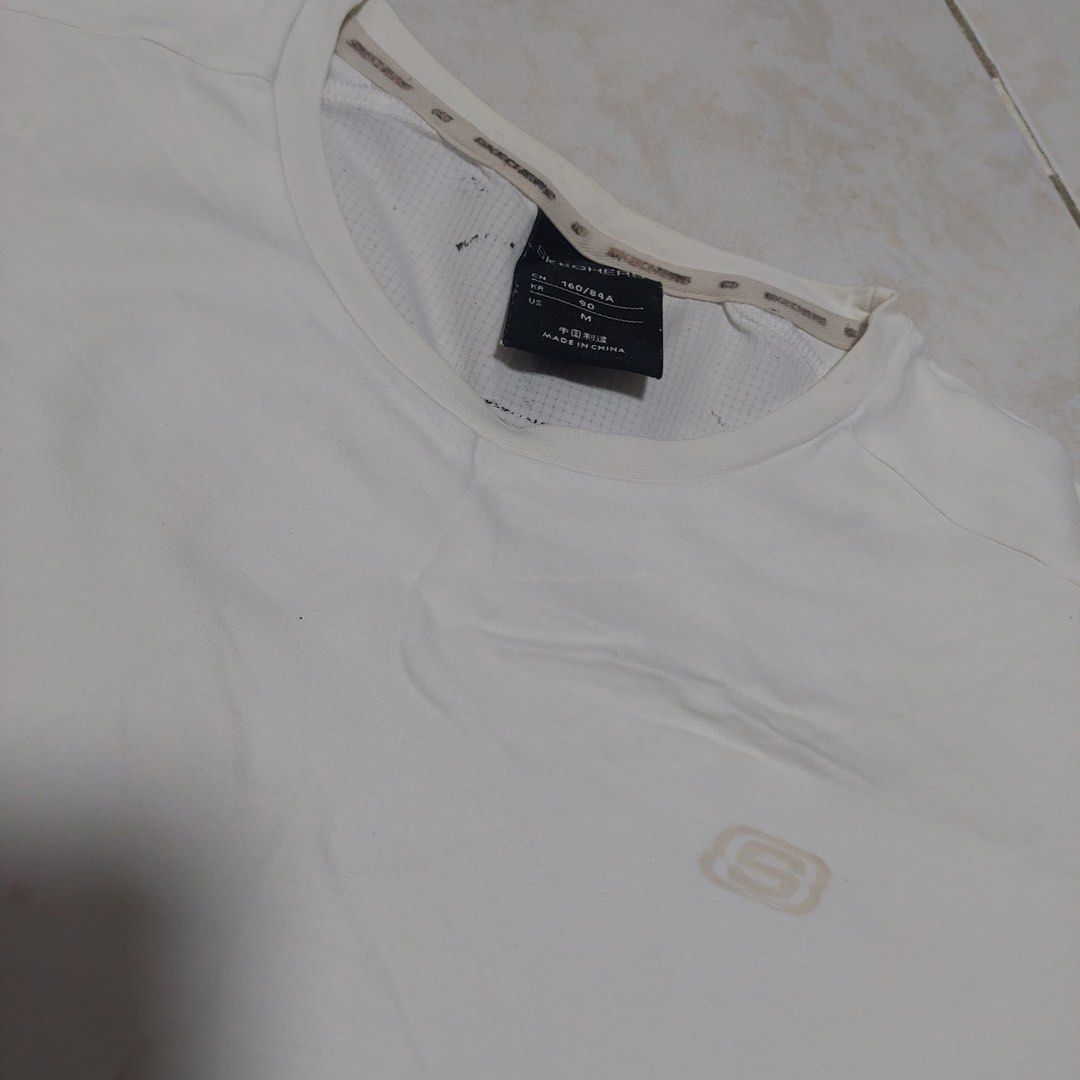 Skechers T-shirt Medium White (Category: Tshirts & Polo Shirts ) located in Quezon City. Submitted by _ysxh (Listing ID 1448296793, Image 2). Description: - White Skechers T-shirt - Size: Medium (M) - Measurements: 51cm width, 57.5cm length - Ideal for active wear RFS: Decluttering - Shipping to be shouldered by buyer (Item is located in Quezon City) - Mode of Payment: Online transfer to BDO or BPI, E-wallet (GCash and Maya) Please leave a messag
