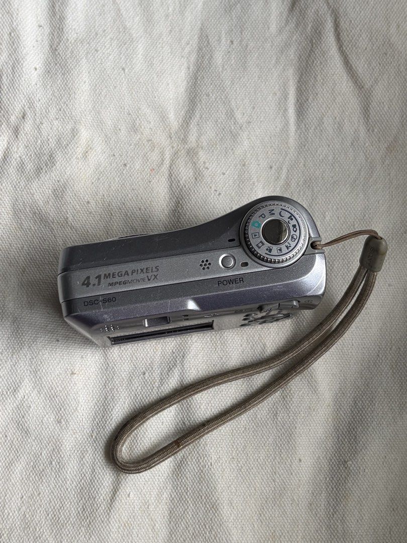 Sony Cybershot DSC-S60 (Category: Cameras) located in Pasig City. Submitted by ysaint (Listing ID 1448330918, Image 3). Description: For sale! Sony Cybershot DSC-S60 compact digital camera in silver for only Php 550. PLEASE READ BEFORE BUYING - Selling AS-IS/UNTESTED. (Natest na with 2AA Batteries, WORKING BUT WITH LCD ISSUE) - NO MEMORY STICK, NO BATTERIES INCLUDED - Inclusions: CAMERA ONLY. Cosmetics: The camera has minor scratches, in good phy