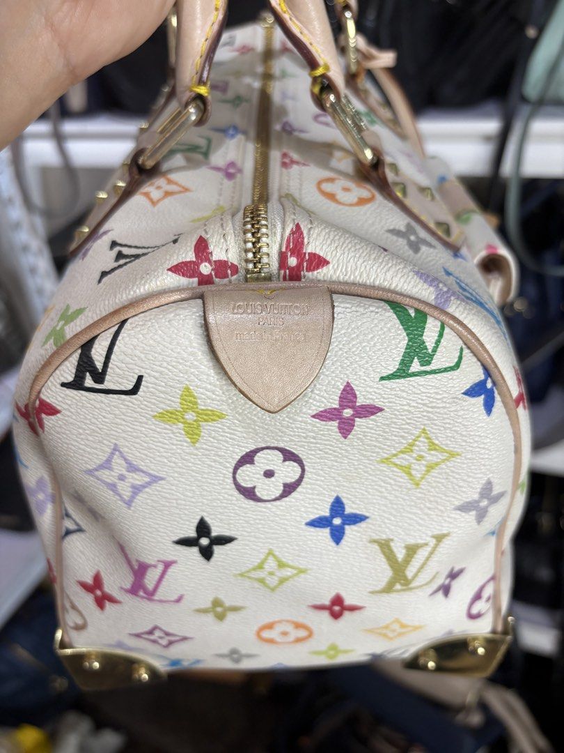 Speedy 30 Multicolore (Category: Luxury Bags & Wallets) located in Cagayan de Oro. Submitted by gjkfashioncollection2008 (Listing ID 1448368681, Image 3). Description: Designer: Louis Vuitton x Takashi Murakami Material: White Monogram Multicolore Canvas with Vachetta leather trim Features: Iconic front pocket with S-lock clasp and distinctive metallic studs.