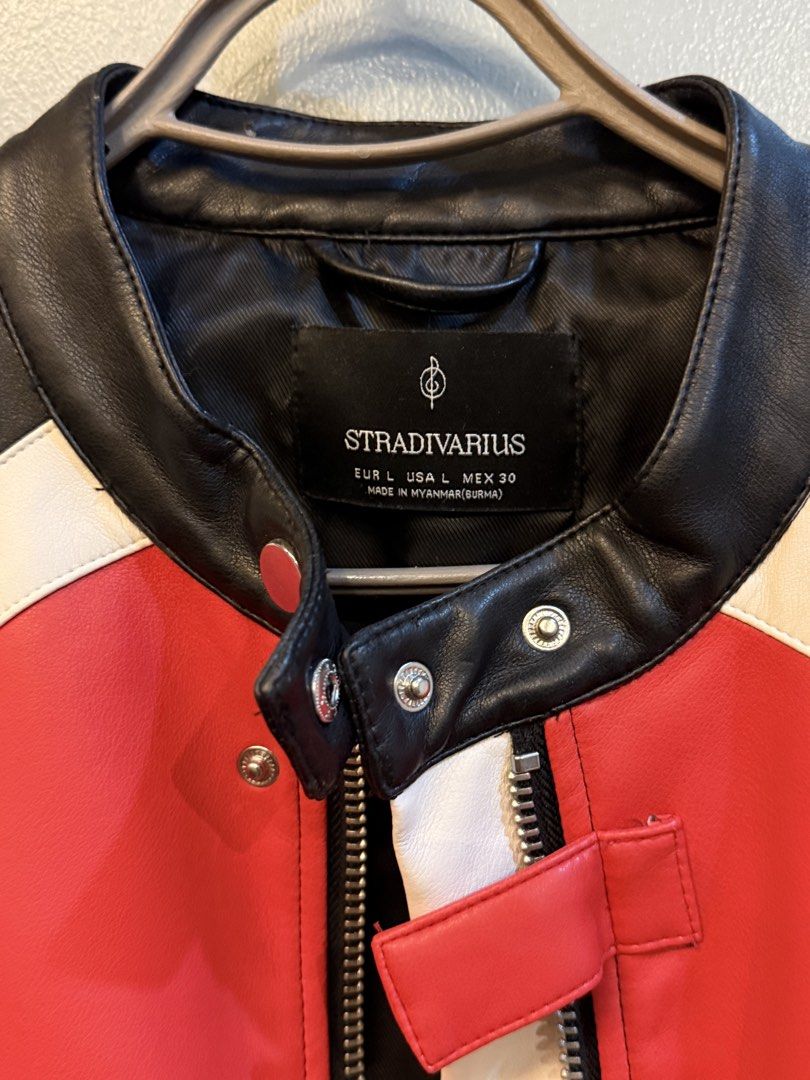 Stradivarius Cropped Biker Jacket Red Black White (Category: Coats, Jackets and Outerwear) located in Taguig. Submitted by clutterdump (Listing ID 1448435163, Image 2). Description: - Stradivarius cropped biker jacket - Bold red, black, and white color block design - Zip-up front closure - Zippered pockets for secure storage - Perfect for layering and adding an edgy vibe.