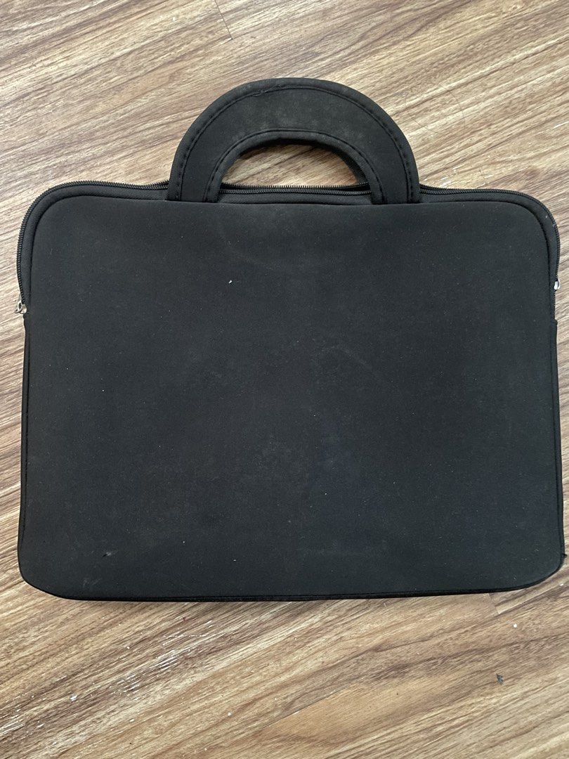 STUDIEUX Black Laptop Sleeve with Handle (Category: Laptop Bags & Sleeves) located in Cavite. Submitted by yvetteroyce (Listing ID 1448336860, Image 3). Description: - Black laptop sleeve with a convenient handle - Features a front pocket for storing accessories - Secure zipper closure to keep your laptop safe - Soft interior lining provides excellent protection - Minor marks on handle and exterior, as pictured - Ideal for protecting your laptop 