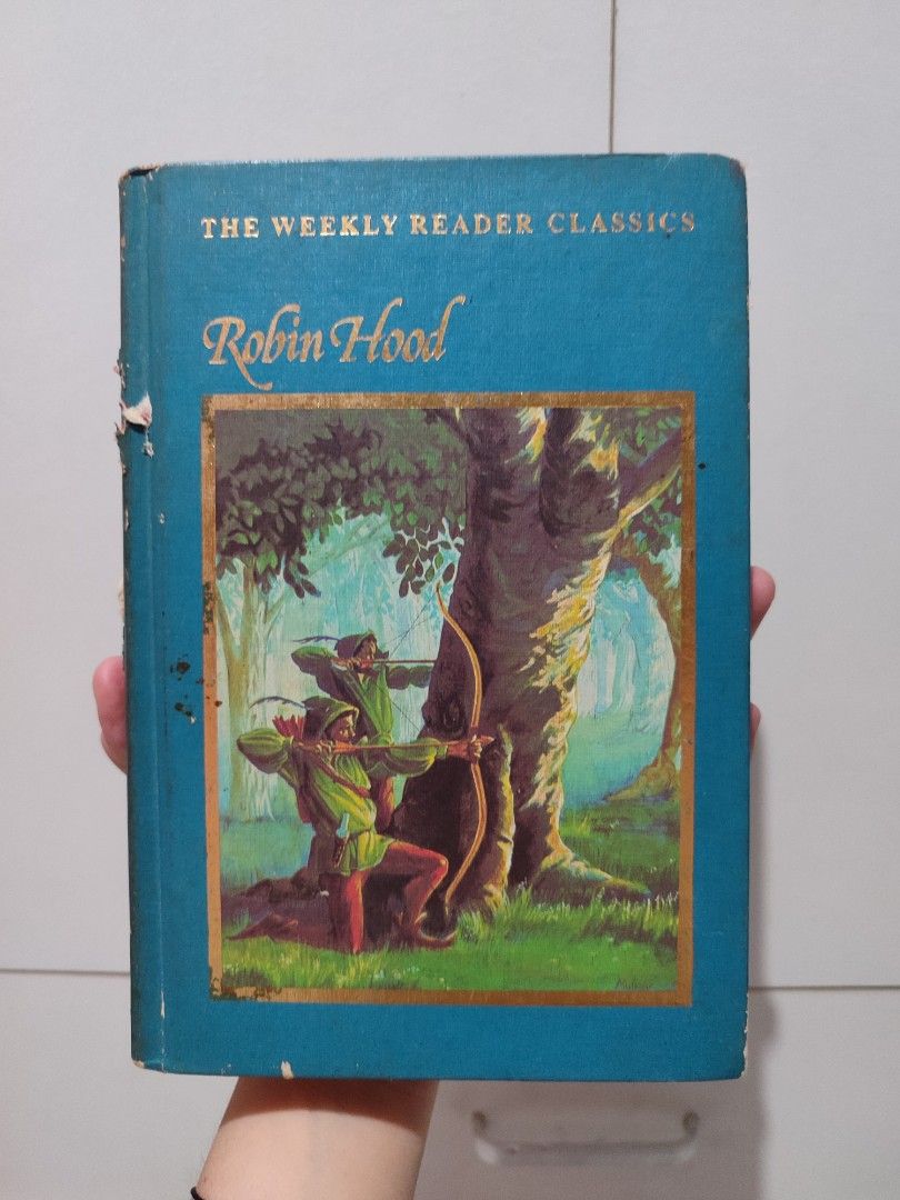 The Weekly Reader Classics Robin Hood Hardcover Book (Category: Storybooks) located in Dasmarinas. Submitted by maruya888 (Listing ID 1448314302, Image 1). Description: Classic edition of Robin Hood by The Weekly Reader. Condition: Cover shows wear on edges and spine, but pages are clean and intact. Ideal for book collectors or young readers. RFS: Decluttering LOC: Dasmariñas, Cavite.