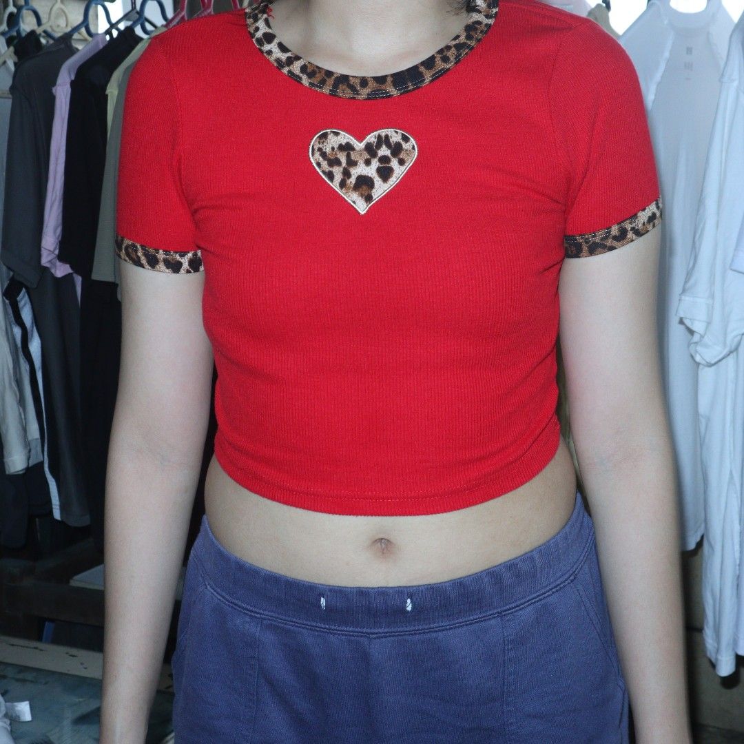 top bundle knitted crop top y2k (Category: Blouses) located in Manila. Submitted by busybuzzingbees (Listing ID 1448292436, Image 3). Description: Red stretchable knitted leopard lining crop top XS Width 11 Length 14in Black short sleeved knitted crew neck crop top with decorative buttons XS Width 11.5in Length 12in (ends right around at the bottom of my ribcage) Loc: Malate, Manila Can meet up around LRT 1 Quirino or Vito Cruz only Shipping thru